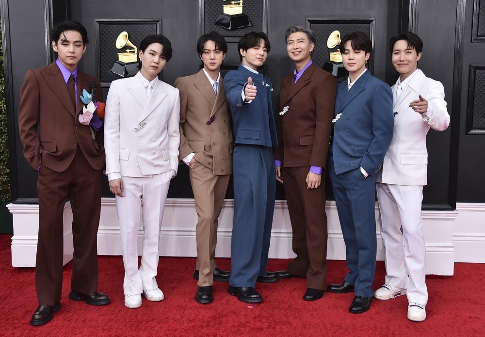 FILE - Korean group BTS appears at the 64th Annual Grammy Awards in Las Vegas on April 3, 2022. BTS, the Grammy-nominated South Korean boy band, will join President Joe Biden next week to talk about “Asian inclusion and representation” and to address hate crimes and discrimination against Asians, the White House announced Thursday, May 26. (Photo by Jordan Strauss/Invision/AP, File)